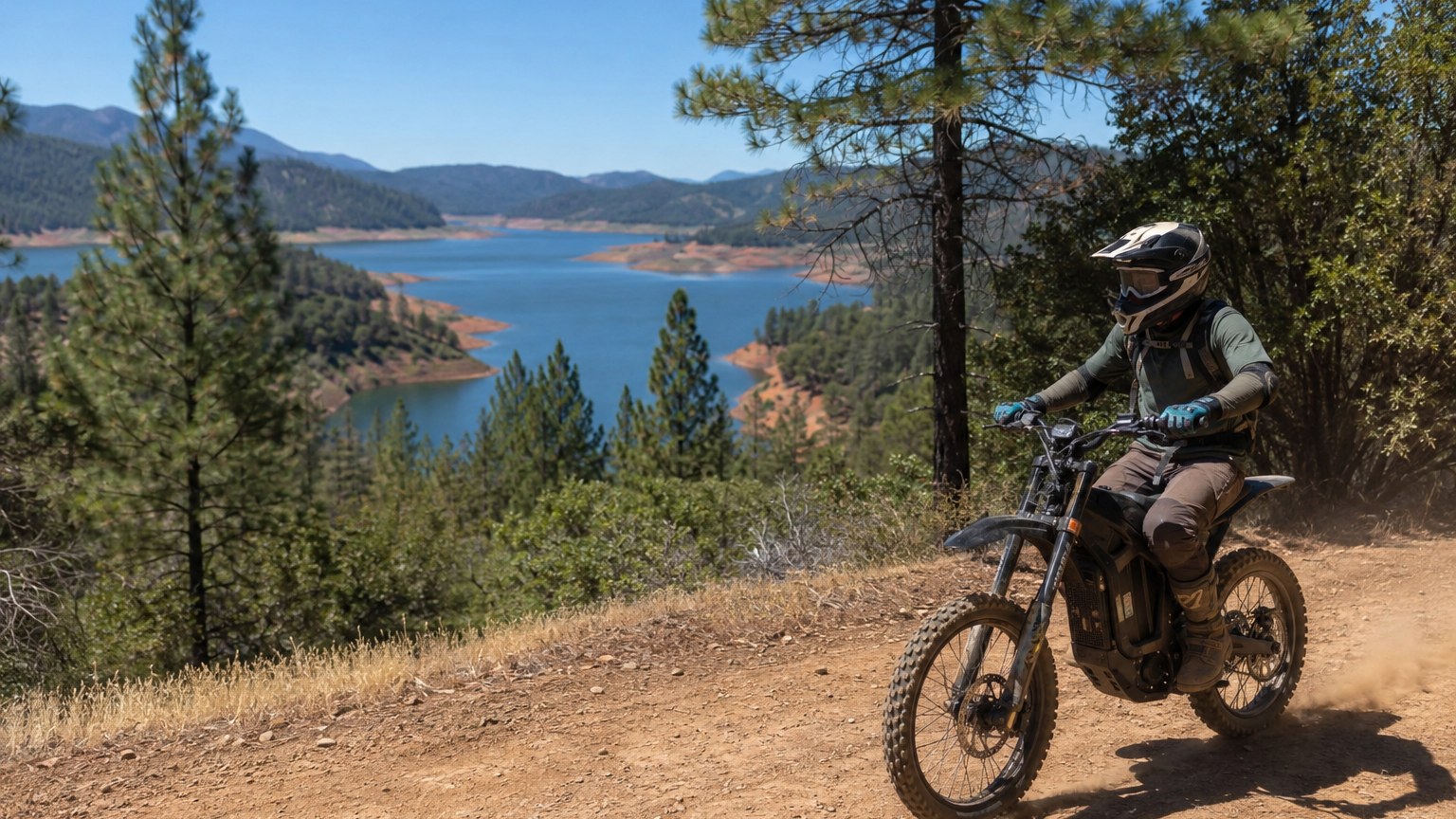 Electric dirtbike rider on a forest trail above Lake Shasta