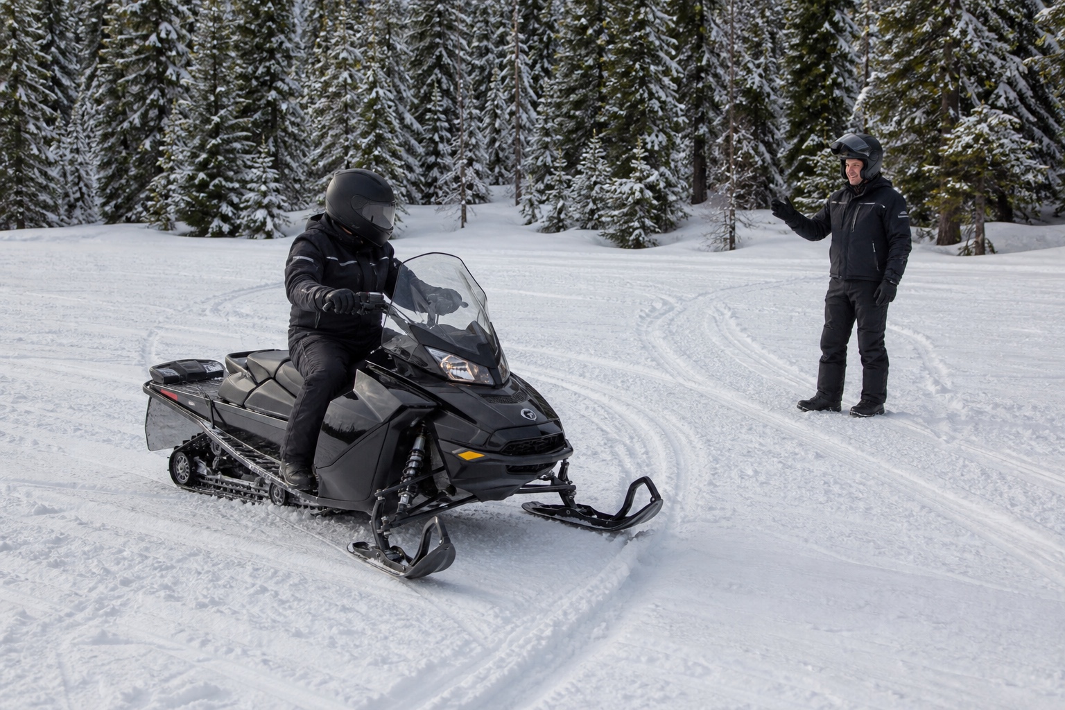 Beginner snowmobiler with instructor